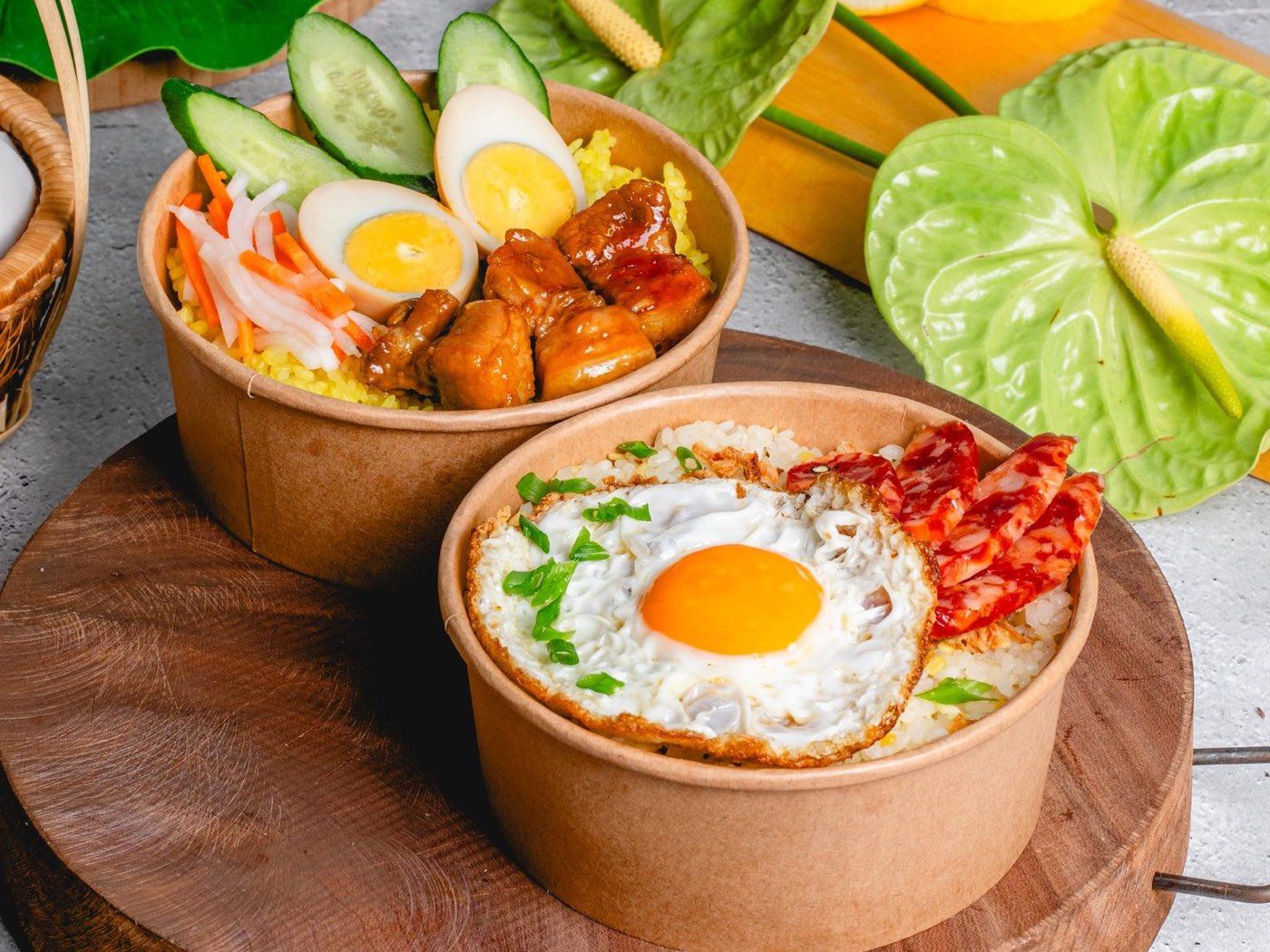 Vietnamese rice bowls in takeout containers