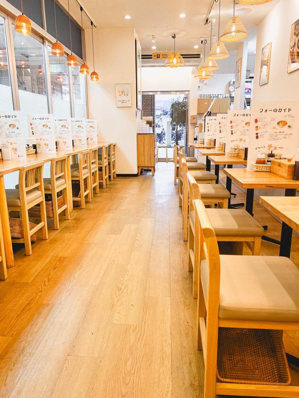 Inside the Viet Origin Hongo store — warm seating under rattan lamps